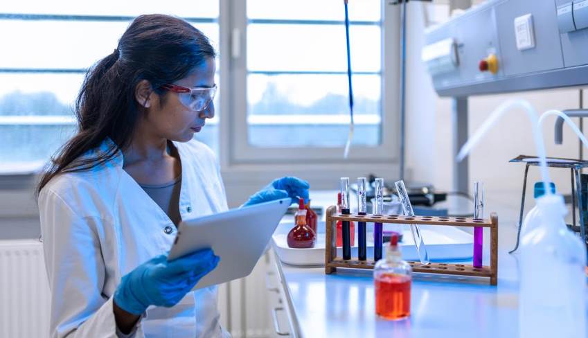 female scientist stands in a laboratory